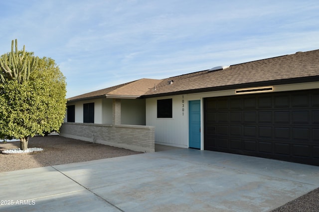 ranch-style home with a garage