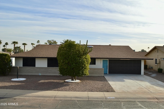 single story home featuring a garage