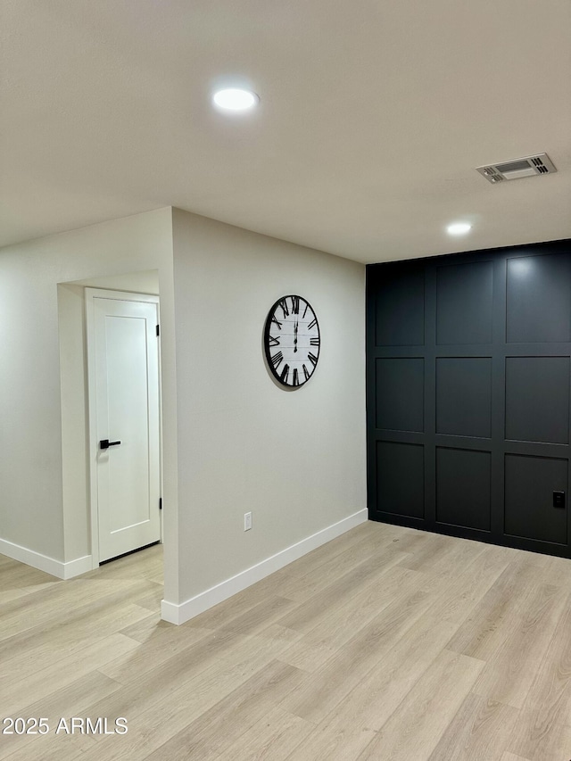 unfurnished room featuring light hardwood / wood-style floors