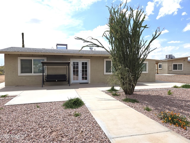 144 N Cactus Rd, Apache Junction, AZ 85119 - rear view of property featuring french doors, stucco siding, and a patio