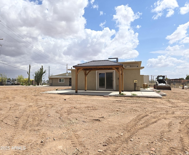 144 N Cactus Rd, Apache Junction, AZ 85119 - back of property with a patio area and stucco siding