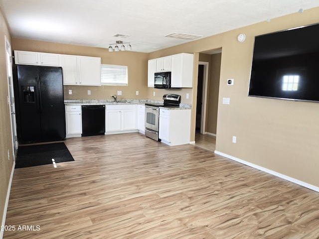 144 N Cactus Rd, Apache Junction, AZ 85119 - kitchen featuring black appliances, light wood-style floors, white cabinetry, light stone countertops, and baseboards