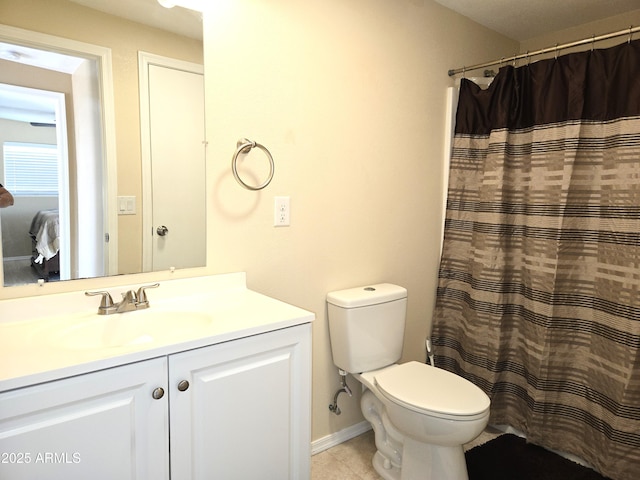144 N Cactus Rd, Apache Junction, AZ 85119 - full bathroom featuring vanity, toilet, tile patterned flooring, a shower with curtain, and baseboards