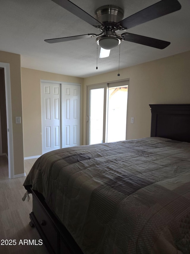 144 N Cactus Rd, Apache Junction, AZ 85119 - bedroom with light wood-type flooring, baseboards, a closet, and a ceiling fan