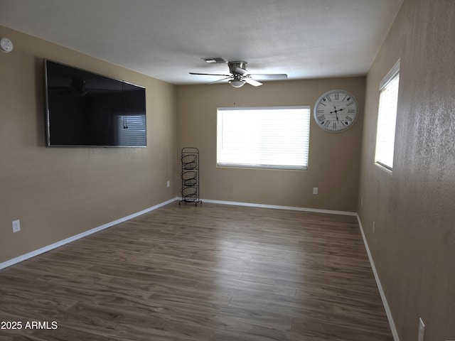 144 N Cactus Rd, Apache Junction, AZ 85119 - unfurnished room featuring ceiling fan, dark wood-style floors, baseboards, and a smoke detector