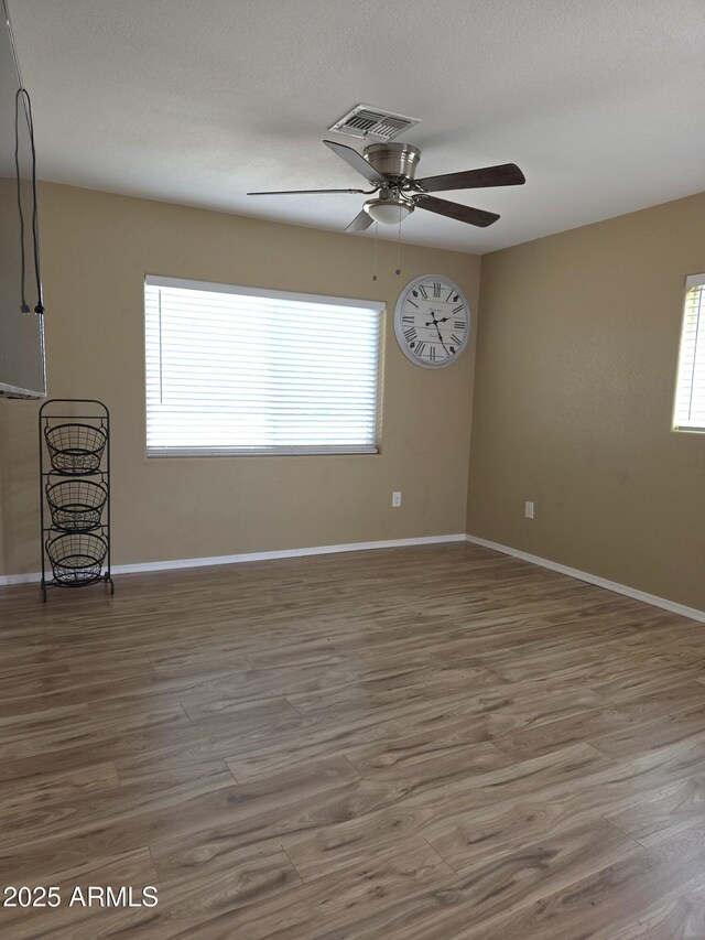 144 N Cactus Rd, Apache Junction, AZ 85119 - spare room with plenty of natural light and wood finished floors