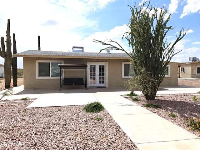 144 N Cactus Rd, Apache Junction, AZ 85119 - back of house with french doors, stucco siding, and a patio area