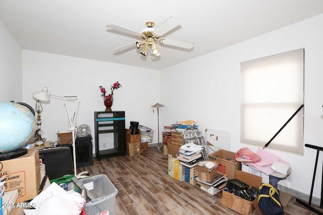 interior space featuring ceiling fan and wood tiled floor