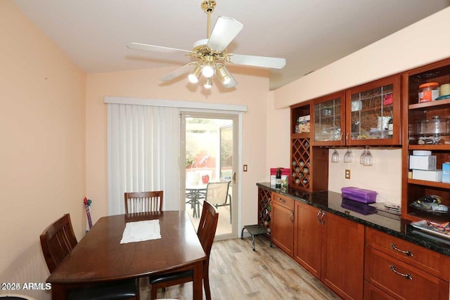 dining room with ceiling fan and light wood finished floors