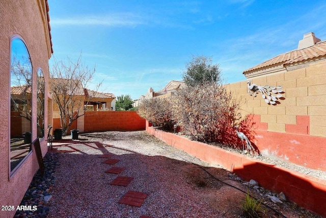 view of yard with a fenced backyard and a patio