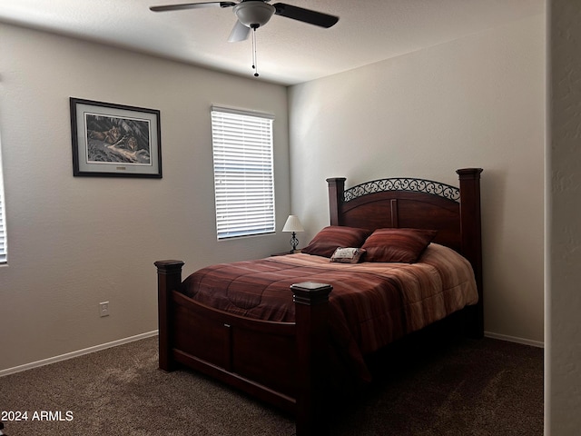 bedroom with dark carpet and ceiling fan