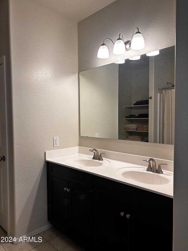 bathroom featuring dual vanity and tile patterned floors