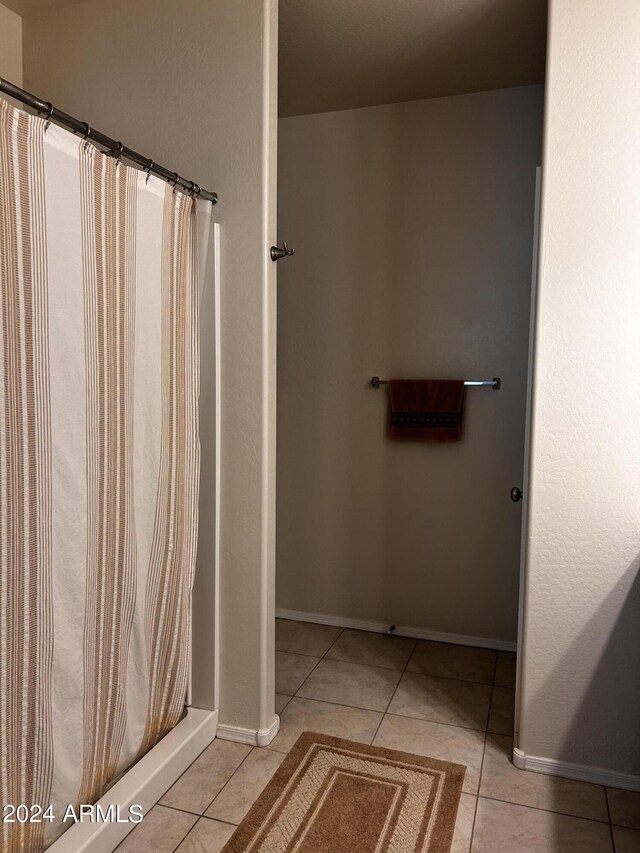 bathroom featuring tile patterned flooring