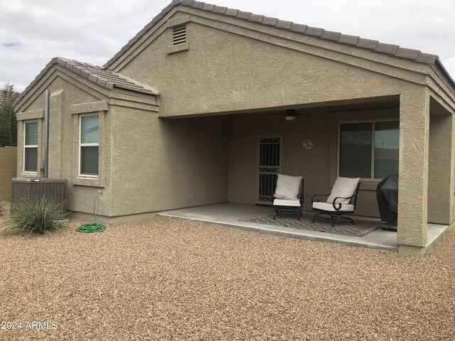 back of property featuring a patio area and central air condition unit