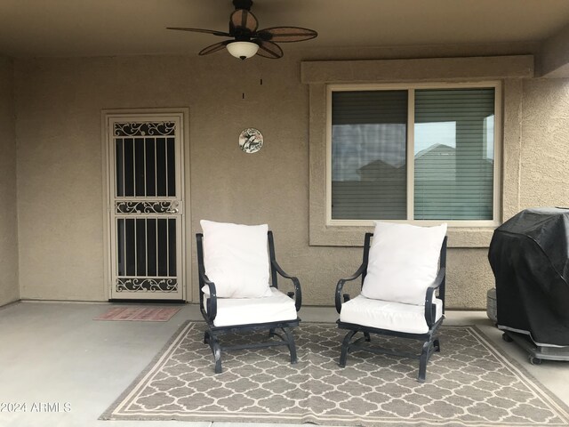 view of patio / terrace with ceiling fan and a grill