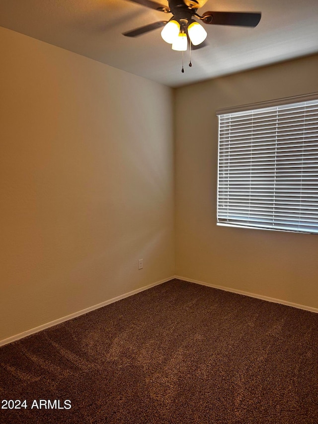 empty room with carpet flooring and ceiling fan