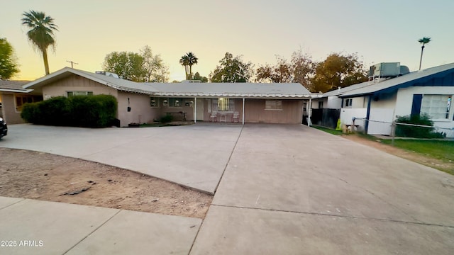 ranch-style house featuring cooling unit