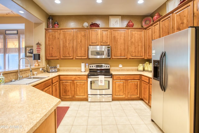 2721 W Snowberry Loop, Show Low, AZ 85901 - kitchen featuring appliances with stainless steel finishes, a sink, recessed lighting, light countertops, and brown cabinetry