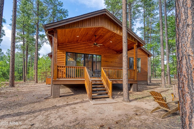 2721 W Snowberry Loop, Show Low, AZ 85901 - view of front of house with a ceiling fan, faux log siding, and a wooden deck