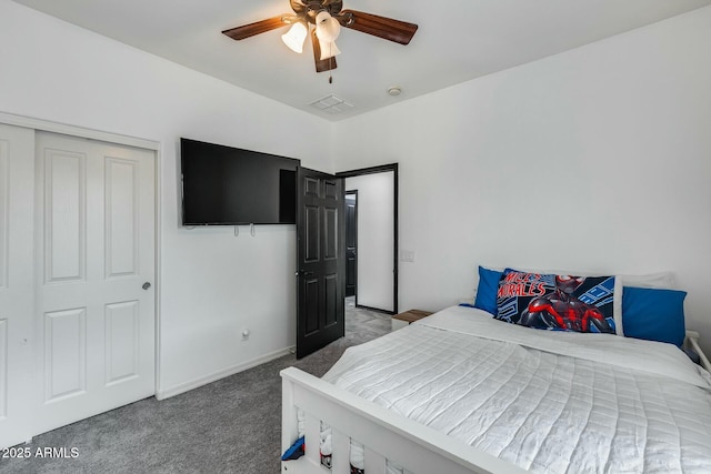 carpeted bedroom featuring a ceiling fan and visible vents
