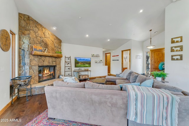 living room with a fireplace, dark hardwood / wood-style floors, and vaulted ceiling