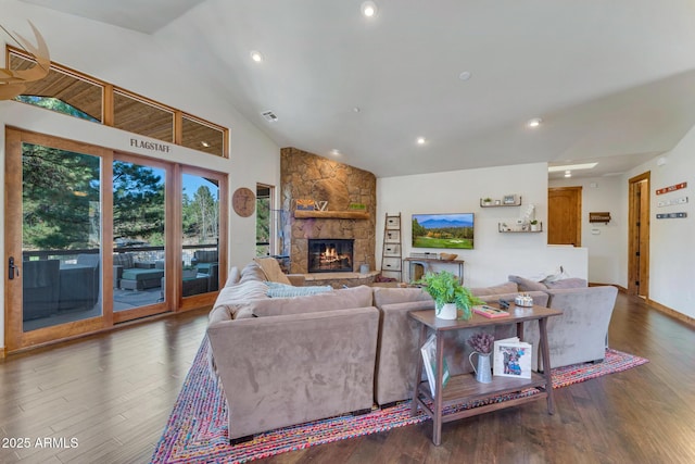 living room featuring a fireplace, high vaulted ceiling, and dark wood-type flooring