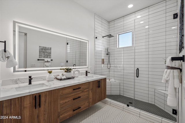 bathroom featuring tile patterned flooring, an enclosed shower, and vanity