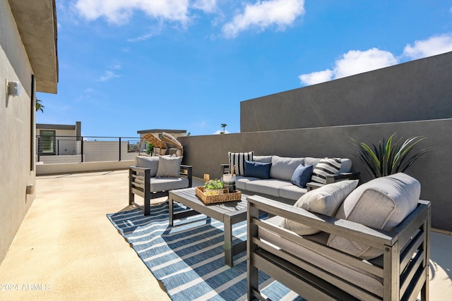 view of patio with a balcony and an outdoor hangout area