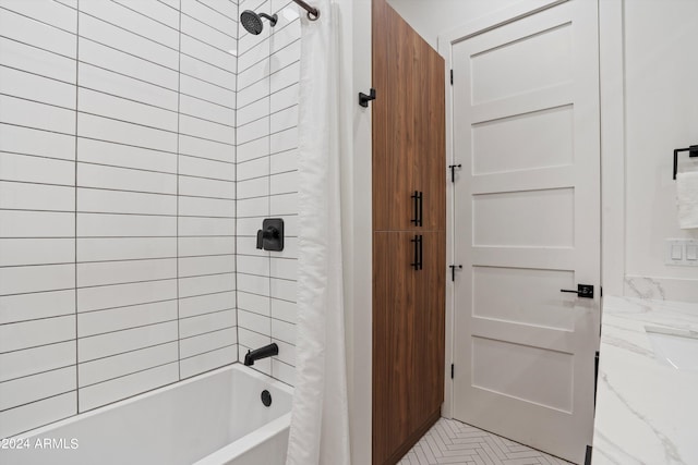 bathroom with vanity and shower / tub combo