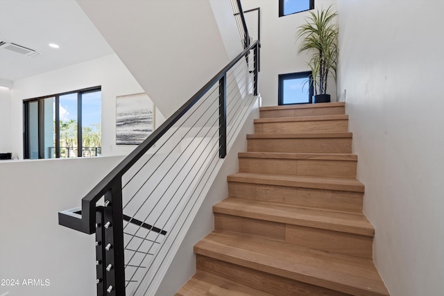 stairway featuring hardwood / wood-style flooring