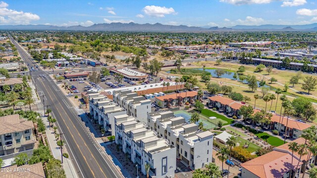 birds eye view of property featuring a water and mountain view