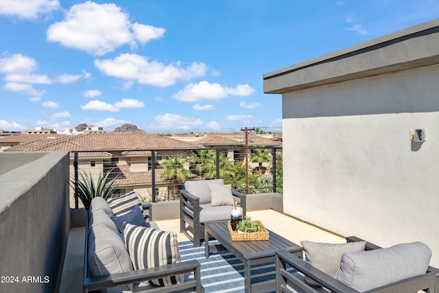 view of patio with a balcony and an outdoor living space