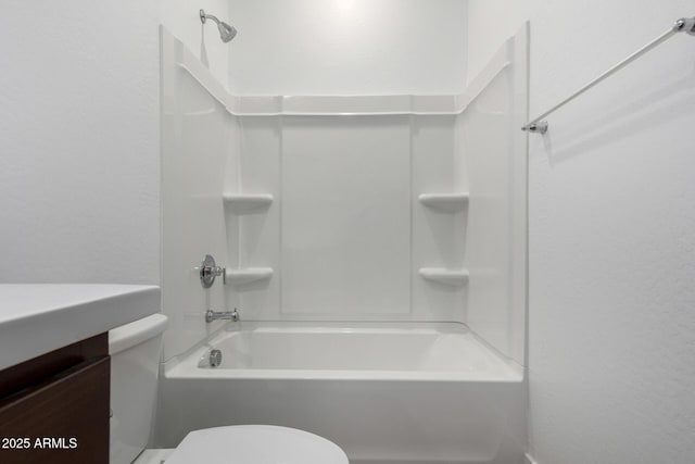 full bathroom with vanity, bathing tub / shower combination, and toilet