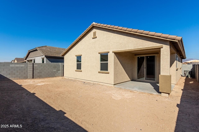 rear view of house with a patio area