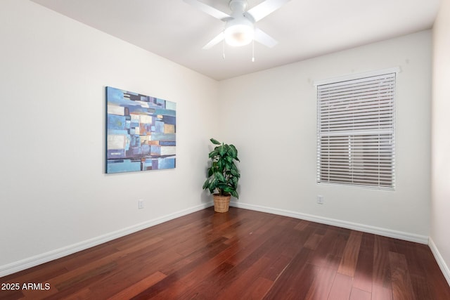 spare room featuring hardwood / wood-style floors and ceiling fan