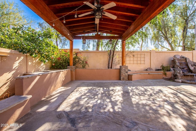 view of patio featuring ceiling fan