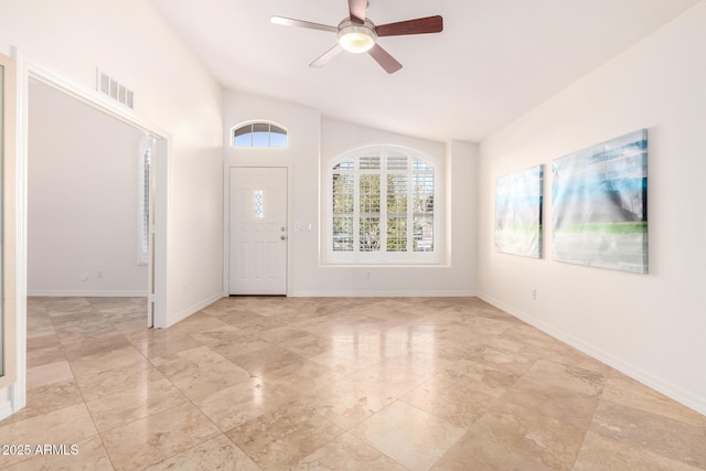 foyer with ceiling fan and lofted ceiling