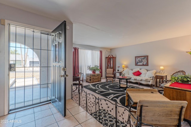 living room with healthy amount of natural light and light tile patterned floors