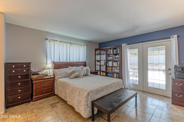bedroom featuring access to outside and light tile patterned floors