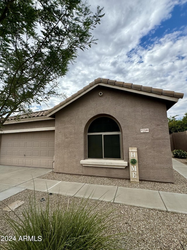 view of front of home with a garage