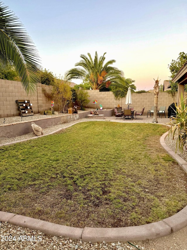 view of yard featuring a fenced backyard and a patio