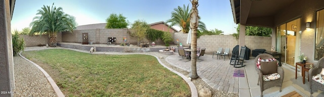 view of yard featuring a patio and a fenced backyard