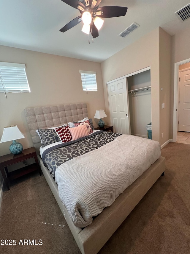 bedroom with carpet flooring, a closet, and ceiling fan