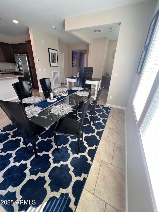 view of tiled dining space