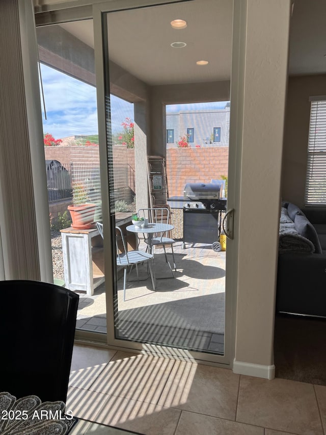 entryway with light tile patterned floors