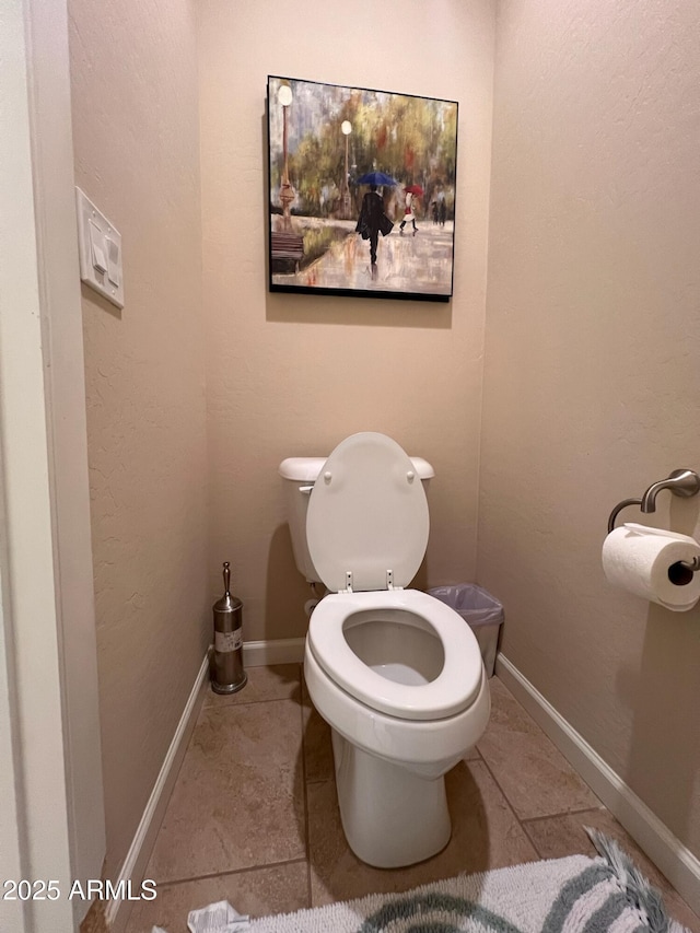 bathroom featuring tile patterned flooring and toilet