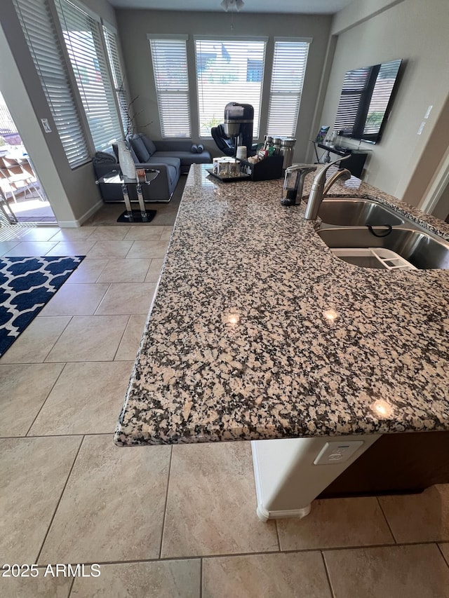 room details featuring stone countertops and sink