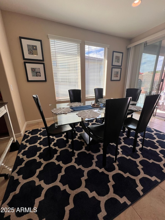 dining area featuring tile patterned flooring