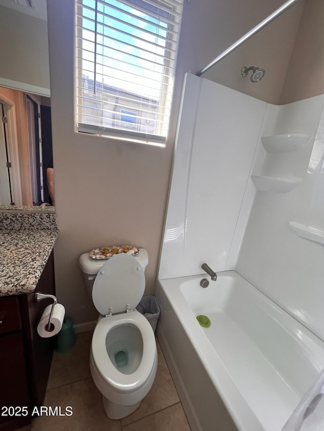 full bathroom featuring tile patterned flooring, bathtub / shower combination, vanity, and toilet