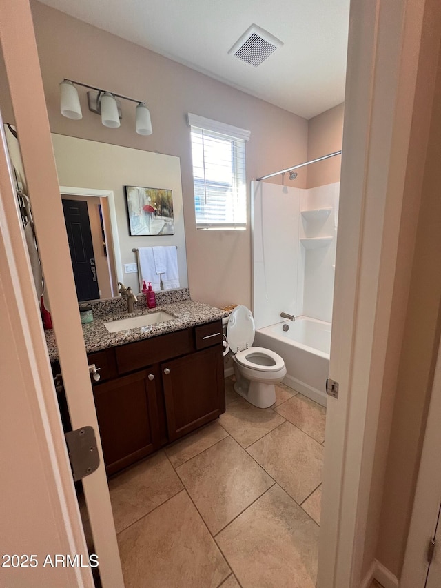 full bathroom featuring toilet, tile patterned flooring, bathtub / shower combination, and vanity